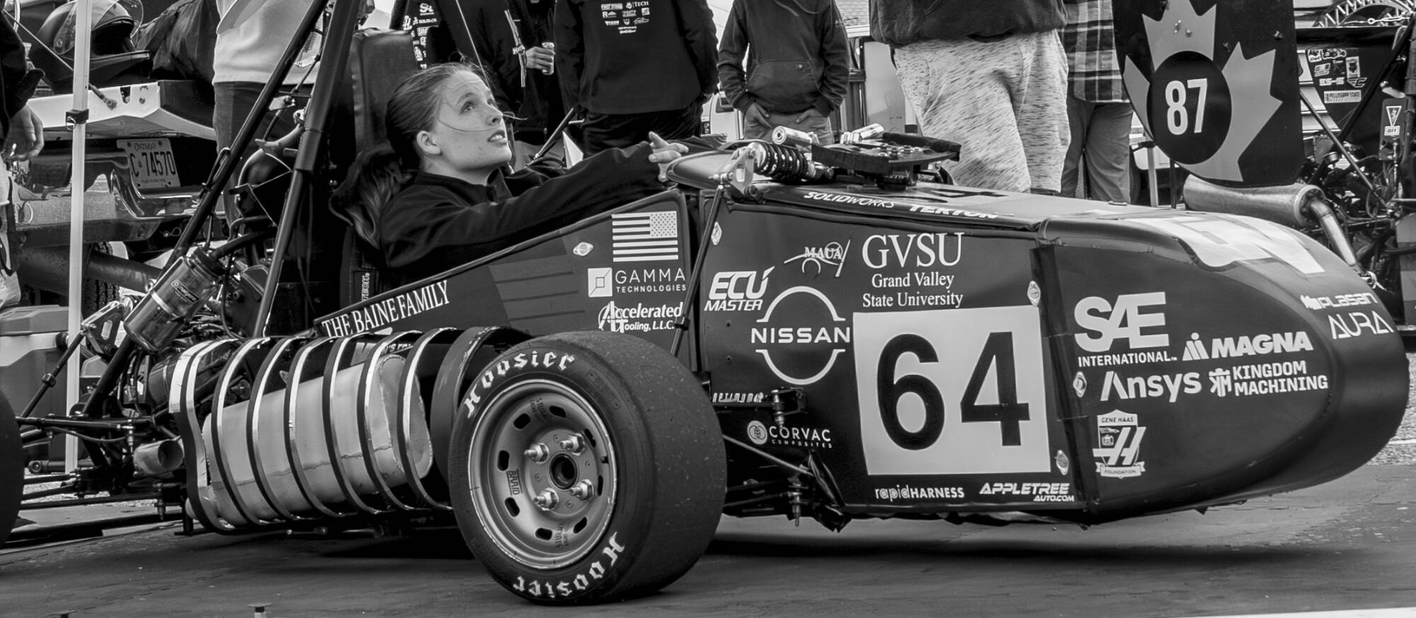 Mechanical Engineering senior Annika Mattson in the Formula SAE car at the 2025 competition.